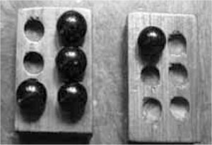 Conventional braille teaching relies on the use of a wooden plate that has six dips representing a Braille cell and a glass marble that has to be placed in the dips to form a Braille character