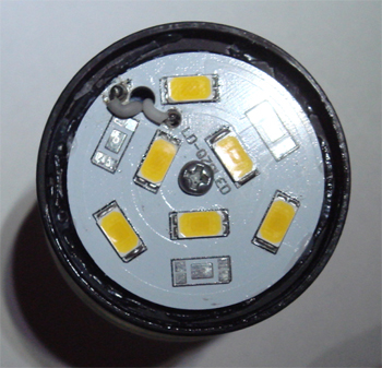 Figure3. Inside view of an 8 Watt LED bulb showing the placement of six power LEDs. The LEDs are mounted on an aluminium core printed circuit board for improved heat removal.