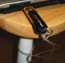 Fig. 5: Laptop locked to a table using USB flash drive