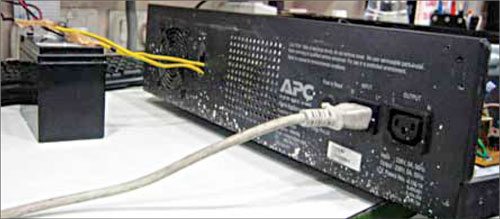 Fig. 3: Rear panel of APC 800VA inverter showing input cord and output socket