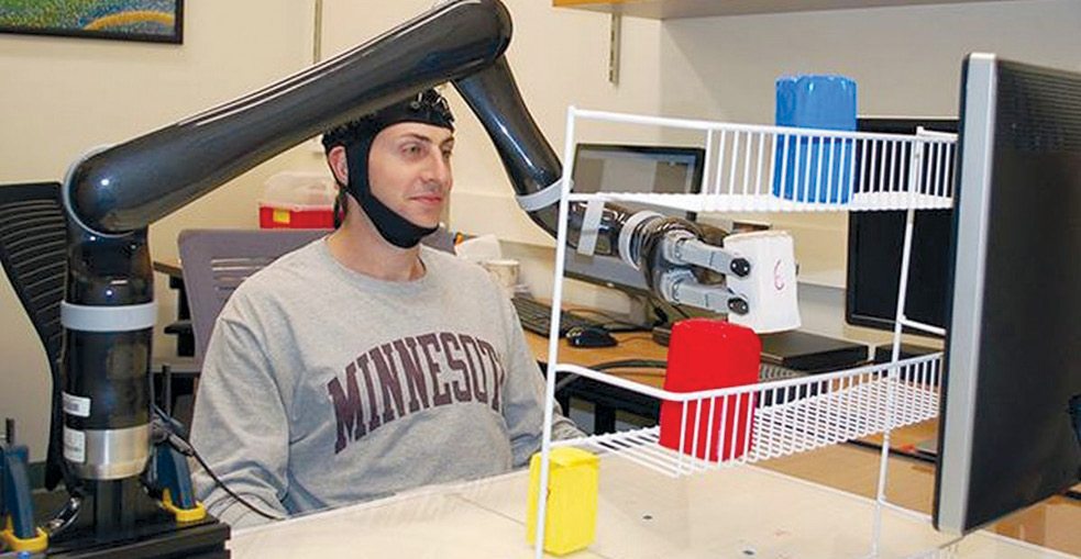 Research subjects at University of Minnesota fitted with a specialised non-invasive brain cap were able to move the robotic arm just by imagining moving their own arms (Image courtesy: University of Minnesota)