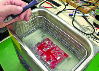 Removal of flux from printed circuit board using an ultrasonic cleaner