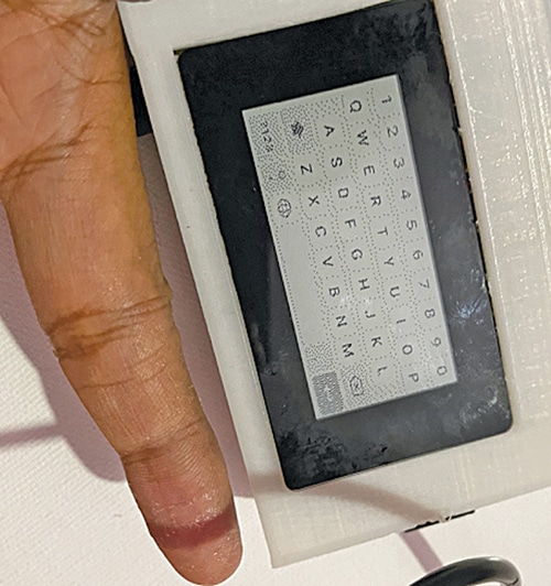 Fig. 4: Laptop size compared to finger