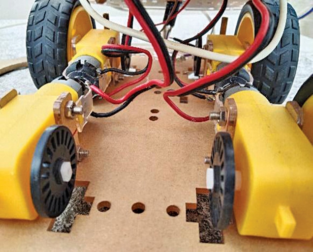 Fig. 5: Attaching gear motor to chassis
