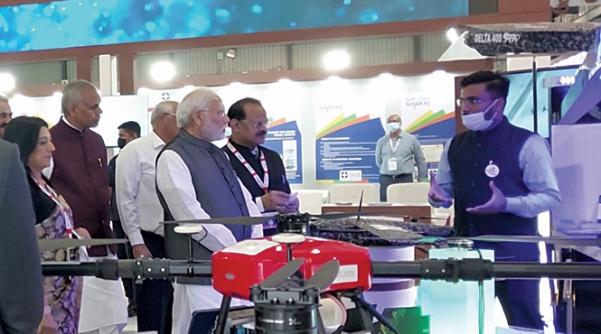 Bodhisattwa Sanghapriya, founder and CEO of IG Drones, welcoming Prime Minister Modi at the IG Drones stall at Defence Expo-22 in Gandhinagar, Gujarat