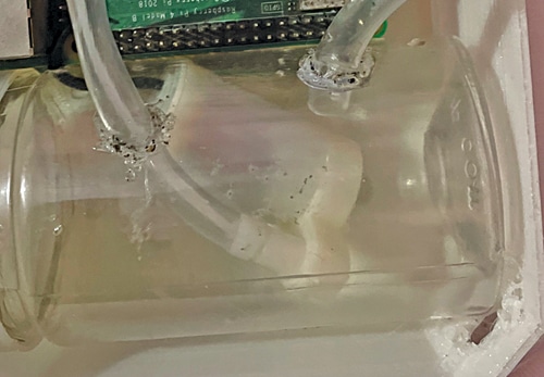 Fig. 4: Water inlet and outlet holes made airtight and leakproof with glue