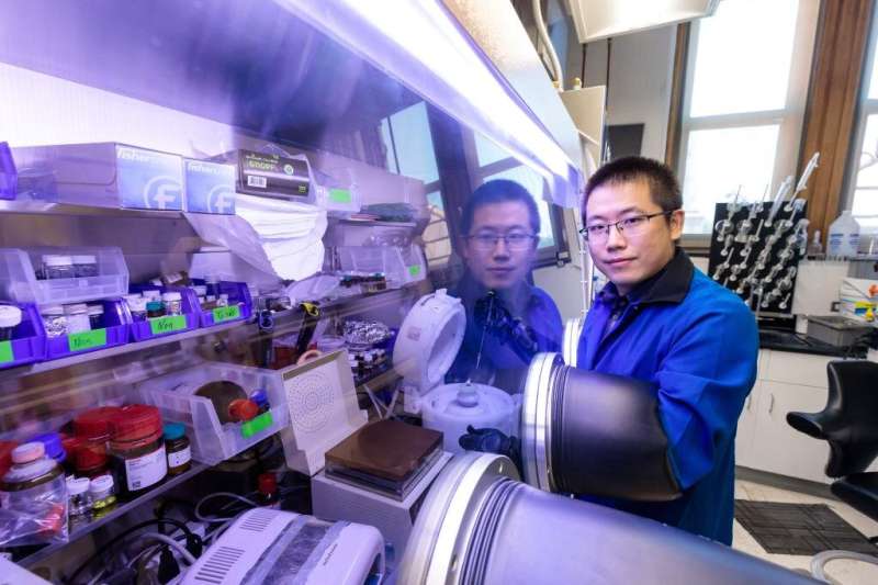 Researchers at the Pritzker School of Molecular Engineering at the University of Chicago, led by Sihong Wang (above) and Juan de Pablo, have designed a material which can bend in half or stretch to more than twice its original length while still emitting a fluorescent pattern. Credit: John Zich/University of Chicago