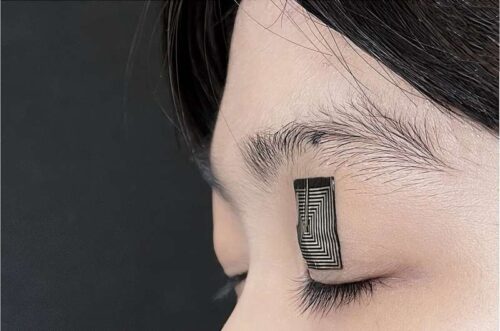 Photograph of the team's sensor mounted on a human eyelid show a conformal interface with the eyelid tissue when the eye is closed. Credit: Jun Chen Lab/UCLA.