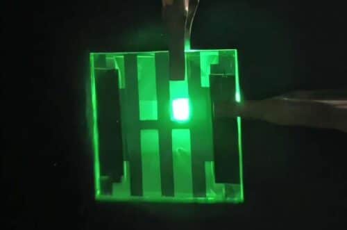 A paper-thin device uses quantum dots, similar to those described in this work, to light up LEDs. Credit: Lin Zhou, Xianghua Wang