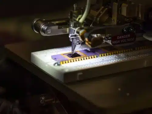 Study: Array of mini-graphene-silicon solar cells intermittently recharges storage capacitors powering a temperature sensor. Soldering a graphene-based sensor. Image Credit: University of Arkansas