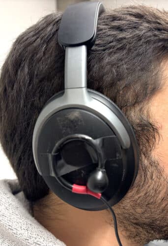 The team combined off-the-shelf noise-canceling headphones with binaural microphones to create the prototype, pictured here.Hu et al./EMNLP