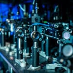 Optical Cavities Enabling Faster Quantum Computing