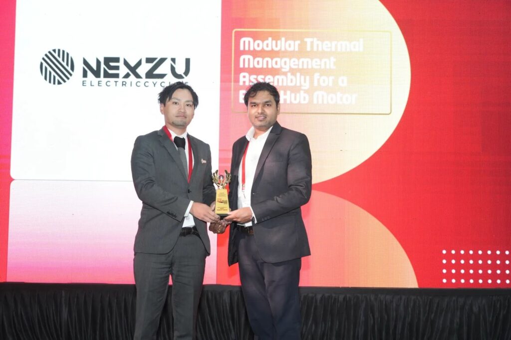 Mr Vivek Dawange from Nexzu Mobility receiving the award for developing ‘modular thermal management assembly for BLDC hub motors’ from Mr Kouhei Shigemori of DJK India