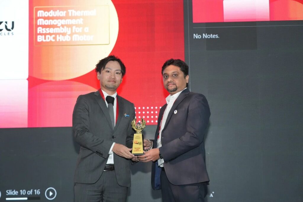 Dr Chetan Solanki from SLTL being awarded for creating ‘XLS machine, a high-performance laser-cutting system’ by Mr Kouhei Shigemori of DJK India 