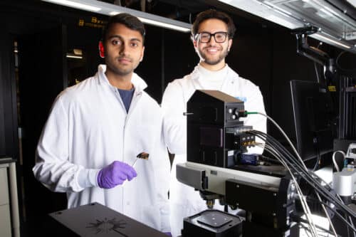 MIT MechE Postdoctoral Associate Aditya Garg (left) and MechE Doctoral student Seleem Badawy stand behind the Raman microscope used to evaluate the Plasmosniff chip.
Credits:Photo: Tony Pulsone