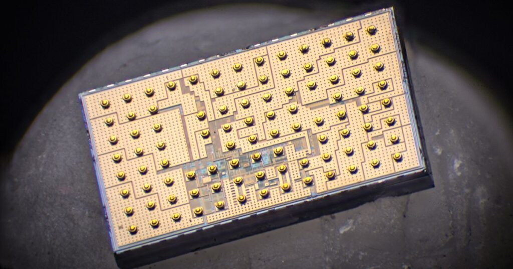 A chip designed to convert high voltages into lower levels in electronics — a process known as DC-DC step-down conversion — more efficiently using a piezoelectric resonator. Photos by David Baillot/UC San Diego Jacobs School of Engineering