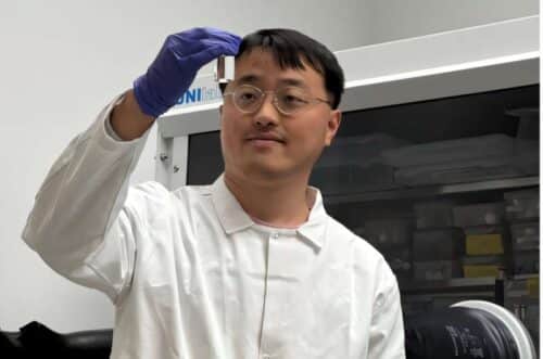 Dejian Dong, the first author of the article, examines a freshly prepared electrolyte sample in the laboratory. Credit: Dong et al.