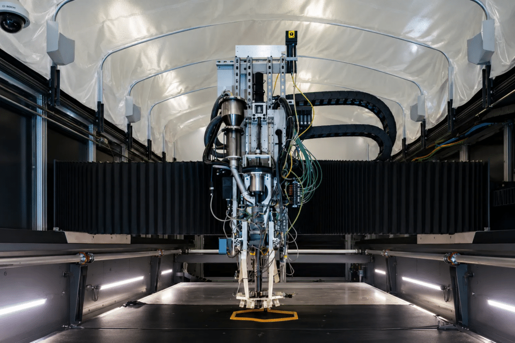 A test object is 3D-printed using a new system to monitor for errors and correct them automatically while manufacturing large items made from plastic composite. Credit: Carlos Jones/ORNL, U.S. Dept. of Energy