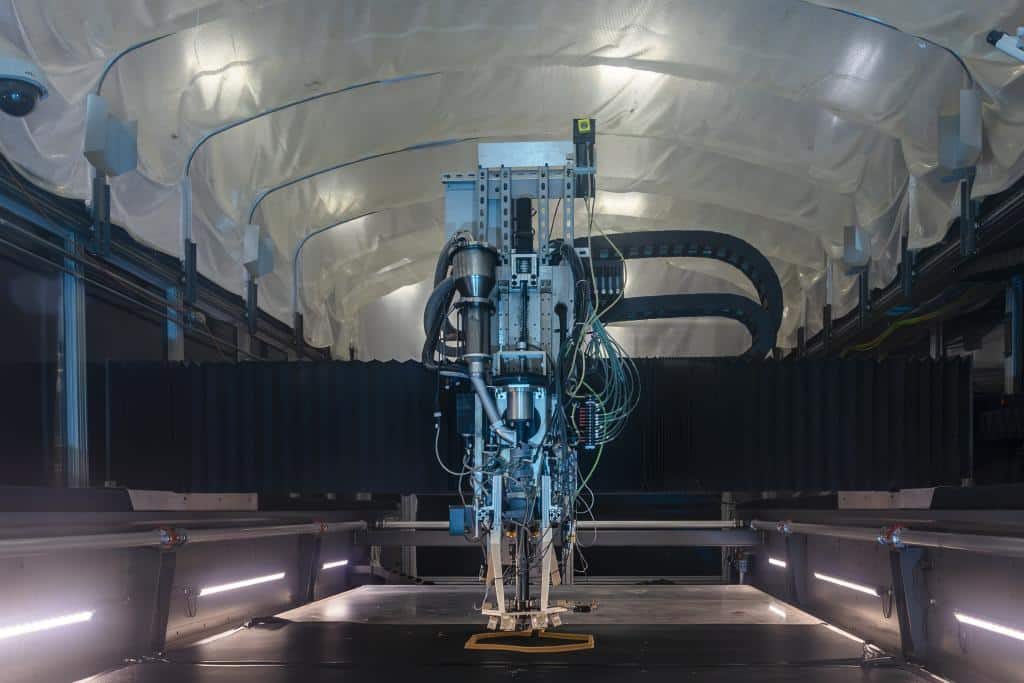 A test object is 3D-printed using a new system to monitor for errors and correct them automatically while manufacturing large items made from plastic composite. Credit: Carlos Jones/ORNL, U.S. Dept. of Energy