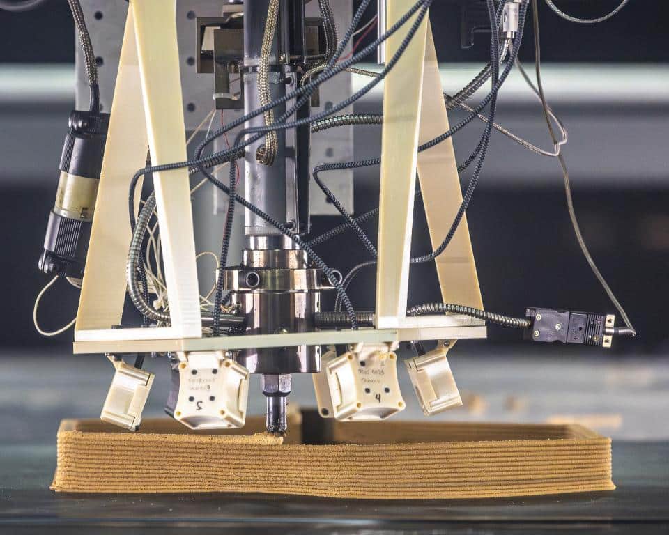 A ring of tiny thermal cameras points at the robotic nozzle depositing plastic composite during testing of the new ORNL platform for correcting 3D printing errors using automation. Credit: Carlos Jones/ORNL, U.S. Dept. of Energy