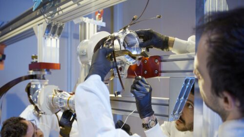 The Sample Transfer Arm (STA), a 2.4-meter robotic arm being prepared for future Moon and Mars exploration.