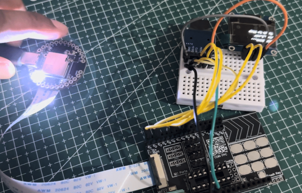 Portable digital voice recorder using an ESP32-S2-based IndusBoard Coin, an INMP441 I2S MEMS microphone, an OLED display, and a microSD card