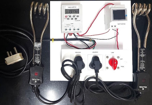 Complete test setup including two 1000 W heaters. (Note: Before applying power, heaters should be immersed in water)