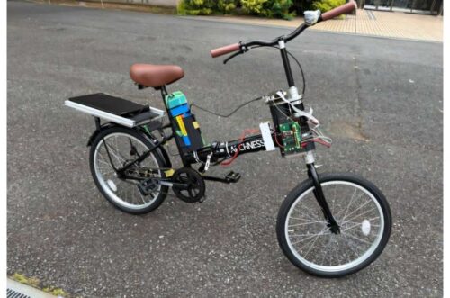 The steer-by-wire bicycle platform developed in this study uses haptic feedback and a machine-learning-based control framework to estimate rider intent and distinguish intentional turning maneuvers from unintended instability. By recognizing riding conditions in real time, it provides stabilization support only when necessary, helping improve safety while preserving natural vehicle handling. Credit: Associate Professor Hiroaki Kuwahara from Shibaura Institute of Technology, Japan