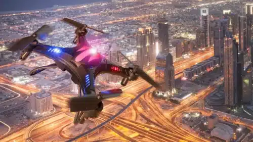 Drone flying over futuristic city.