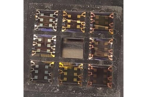 Perovskite solar cells with different back electrodes: silver/aluminum contacts appear bright and mirror-like, gold shows its characteristic warm yellow luster, and copper takes on a distinctive reddish-orange sheen. 