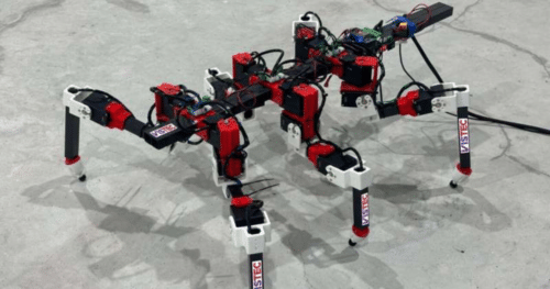 Close-up of the RedMirror robot's red and white leg joints and wiring