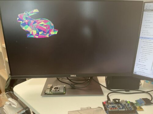 Vivado FPGA development software open alongside a hardware test setup for the TinyGPU graphics processor