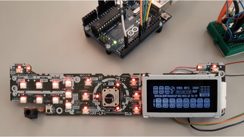 Close-up of the illuminated segment LCD showing WMA, MP3, shuffle and repeat icons