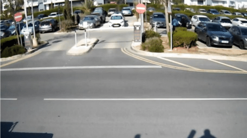 AI vehicle-detection frame showing a red car and blue car with bounding boxes, tracking IDs and vehicle counts moving toward points A and B