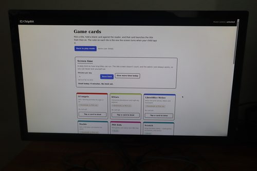 The ChipBit parent console showing a screen-time limit setting and a grid of game cards including GCompris, KStars and LibreOffice Writer, each with a “Tap a card to bind” button