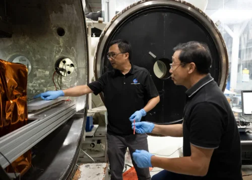 Yi Lin, left, SPEARS testing and research lead, and Ji Su, a polymer materials scientist and the task lead, during the removal of SPEARS batteries from thermal vacuum testing at NASA Langley. (Image credit: NASA/Ryan Hill)